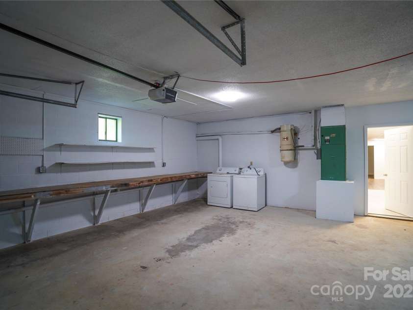 262 Rooster Cove, Brevard, NC 28712.  MLS# CAR4332799, YatesRealty ID 39326. Laundry amenities for downstairs located in garage