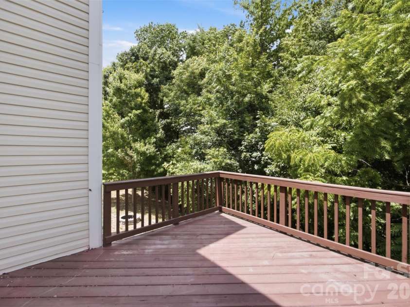 423 Fischer Road, Fort Mill, SC 29715.  MLS# CAR4398304, YatesRealty ID 39339. Elevated deck overlooking the private backyard.
