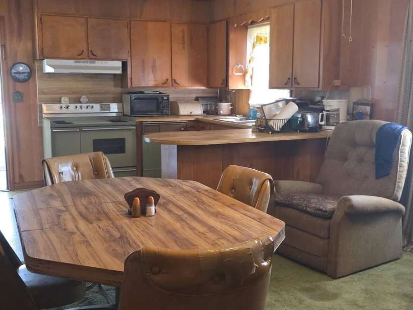 217 Rollings Road, Pageland, SC 29728.  MLS# CAR4382180, YatesRealty ID 39342. Den/dining area looking towards kitchen