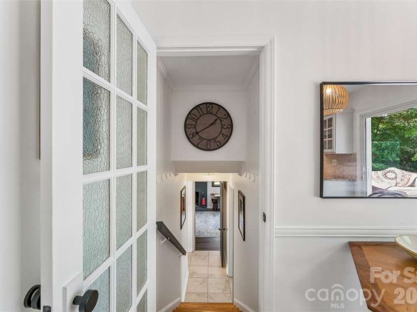 2815 Burnt Mill Road, Charlotte, NC 28210.  MLS# CAR4394157, YatesRealty ID 39346. Stairs from kitchen to basement