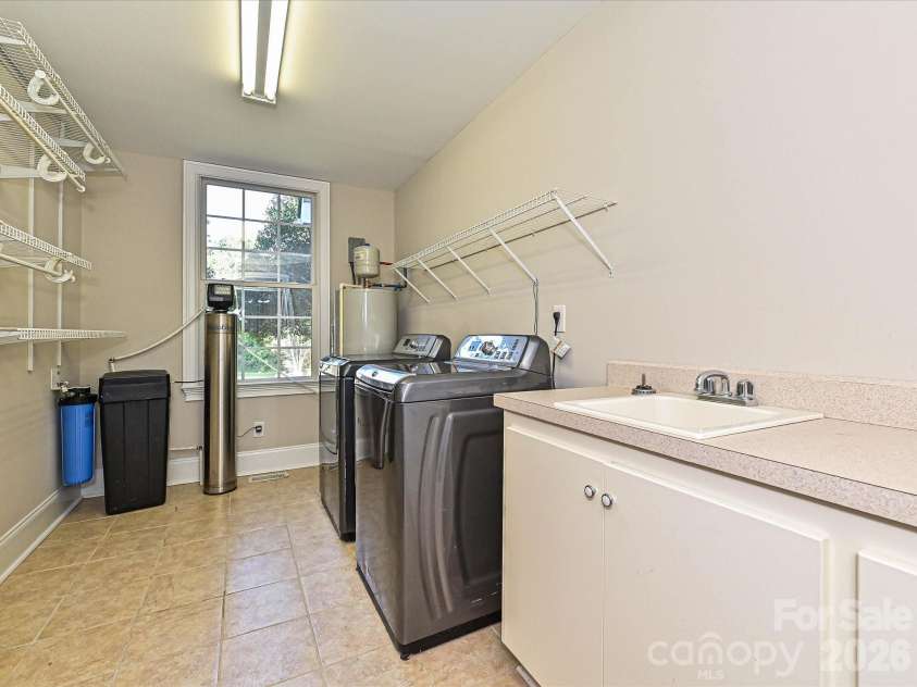 2354 Perry Road, Denver, NC 28037.  MLS# CAR4405892, YatesRealty ID 39365. Downstairs Laundry room