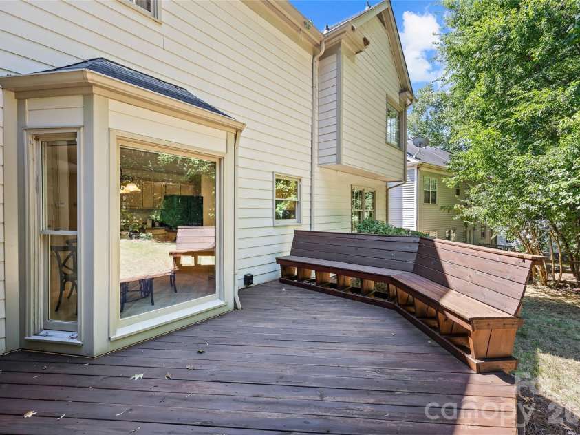 9120 Cameron Wood Drive, Charlotte, NC 28210.  MLS# CAR4403307, YatesRealty ID 39374. The deck with seating opens into a flat backyard.