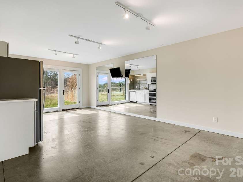 76 Murray Debruhl Road, Alexander, NC 28701.  MLS# CAR4345165, YatesRealty ID 3942. Workout area/ Kitchen