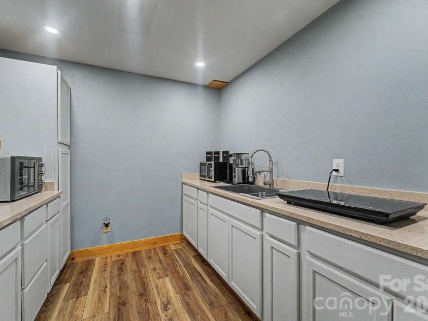 91 Tibi Lane, Waynesville, NC 28785.  MLS# CAR4405996, YatesRealty ID 39433. Downstairs studio apartment kitchen