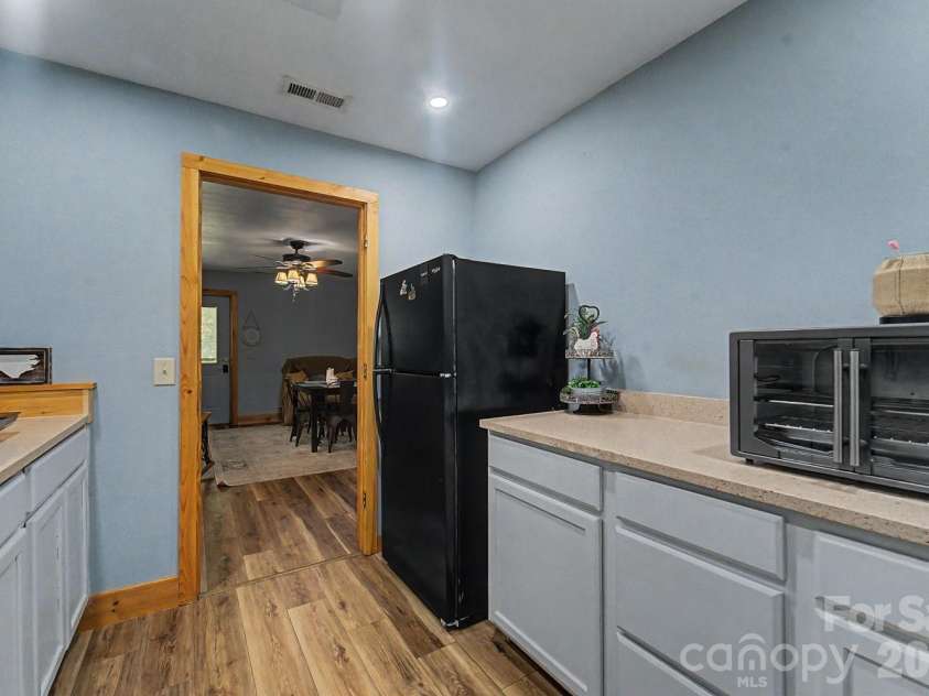 91 Tibi Lane, Waynesville, NC 28785.  MLS# CAR4405996, YatesRealty ID 39433. Downstairs studio apartment kitchen