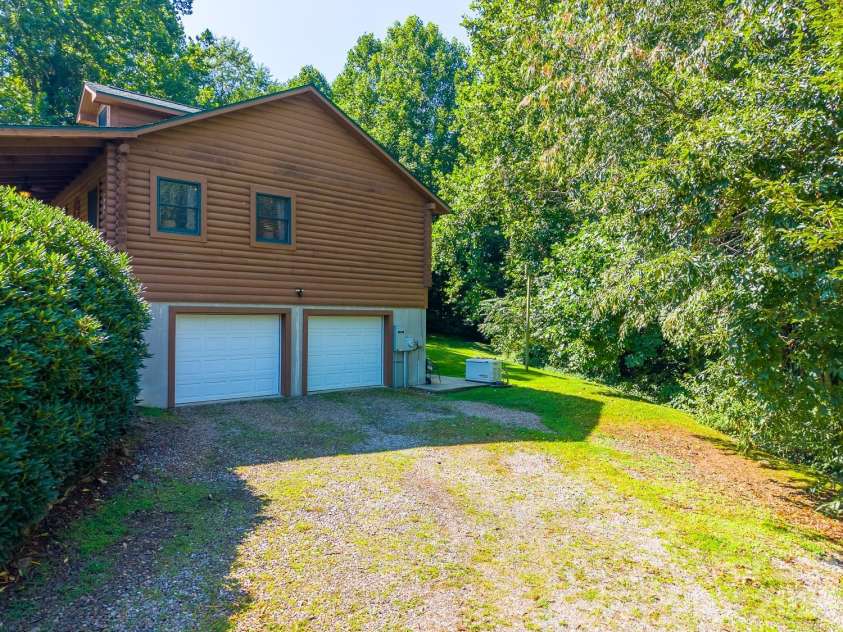 91 Tibi Lane, Waynesville, NC 28785.  MLS# CAR4405996, YatesRealty ID 39433. Two car garage + storage