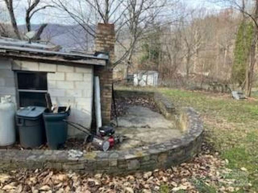 335 Fountain Way, Swannanoa, NC 28778.  MLS# CAR4206177, YatesRealty ID 3946. Side/back of home