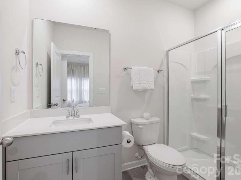 4456 Millennium Avenue, Charlotte, NC 28217.  MLS# CAR4404262, YatesRealty ID 39463. Lower Level Bathroom