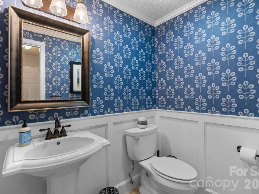 15 Forest Ridge Lane, Weaverville, NC 28787.  MLS# CAR4403480, YatesRealty ID 39471. Main Level Half Bath