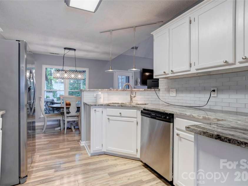3688 Lake Spring Avenue, Concord, NC 28027.  MLS# CAR4406214, YatesRealty ID 39472. Beautiful granite counters and tile backsplash