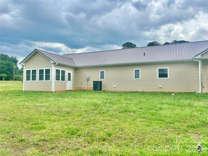 837 Upper Spencer Mountain Road, Gaston, NC 28164.  MLS# CAR4407024, YatesRealty ID 39482. Back side of house