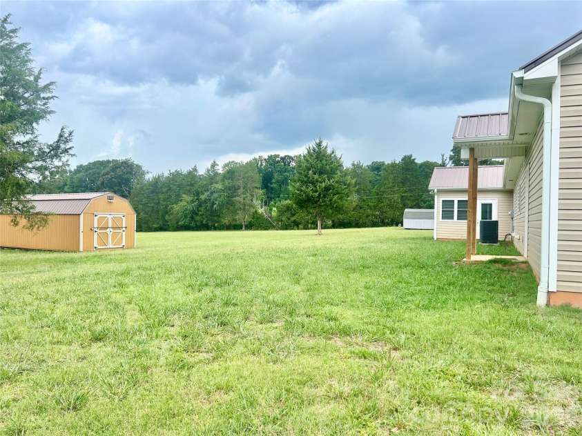837 Upper Spencer Mountain Road, Gaston, NC 28164.  MLS# CAR4407024, YatesRealty ID 39482. Spacious back yard