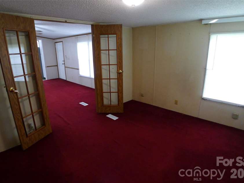116 Hank Lesser Road, Mocksville, NC 27028.  MLS# CAR4406699, YatesRealty ID 39483. Den
