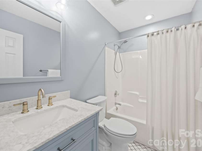 321 Kilmer Lane, Mooresville, NC 28115.  MLS# CAR4405643, YatesRealty ID 39485. Updated hall bathroom