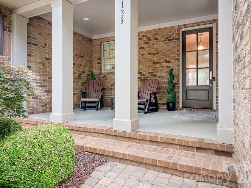 9133 Robbins Preserve Road, Cornelius, NC 28031.  MLS# CAR4399852, YatesRealty ID 39490. A welcoming front porch
