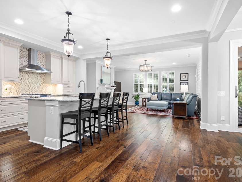 9133 Robbins Preserve Road, Cornelius, NC 28031.  MLS# CAR4399852, YatesRealty ID 39490. Entrance looking into a classicly finished kitchen, dining area and nicely situated family room.