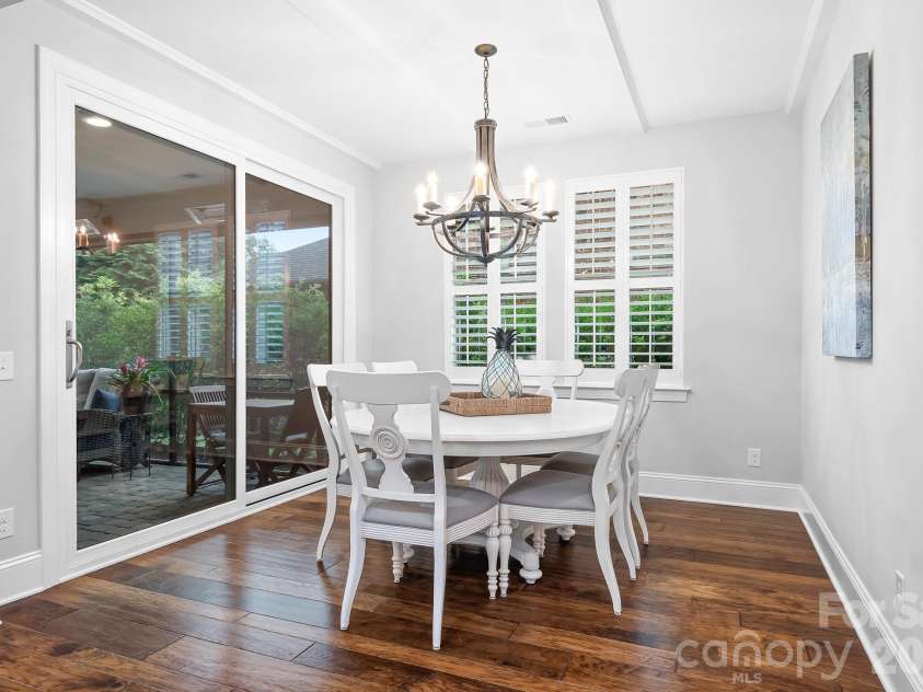 9133 Robbins Preserve Road, Cornelius, NC 28031.  MLS# CAR4399852, YatesRealty ID 39490. Large dining area jut off the kitchen, perfect for everyday dining or special days. Overlooks a beautiful screened porch.
