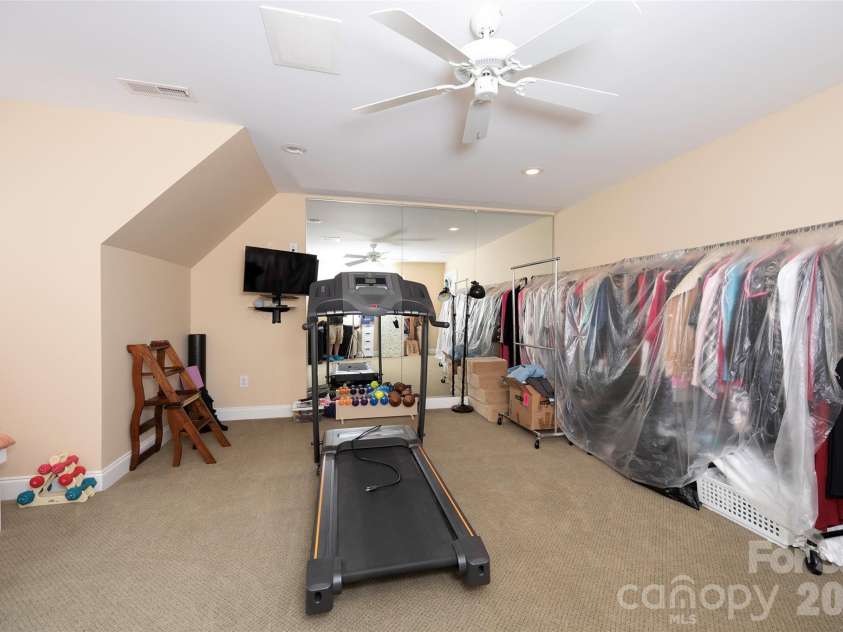 310 James Way, Bermuda Run, NC 27006.  MLS# CAR4406410, YatesRealty ID 39534. 5th Bedroom Used as Exercise Room