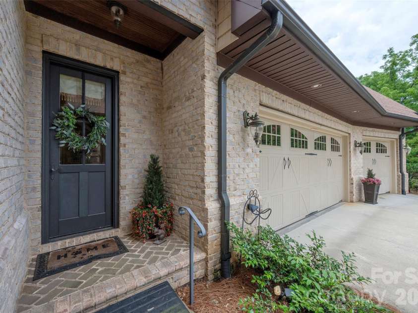 310 James Way, Bermuda Run, NC 27006.  MLS# CAR4406410, YatesRealty ID 39534. Pedestrian Door Adjacent to Garage
