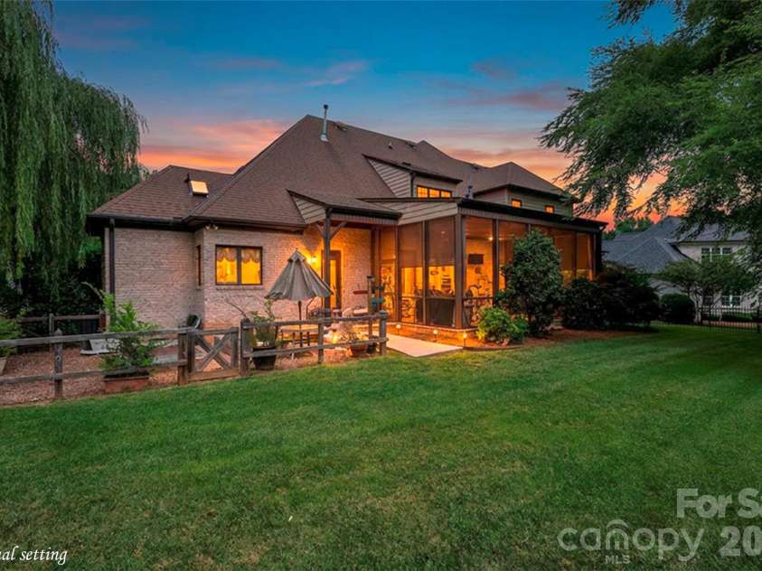 310 James Way, Bermuda Run, NC 27006.  MLS# CAR4406410, YatesRealty ID 39534. Staged Image Shows Twilight