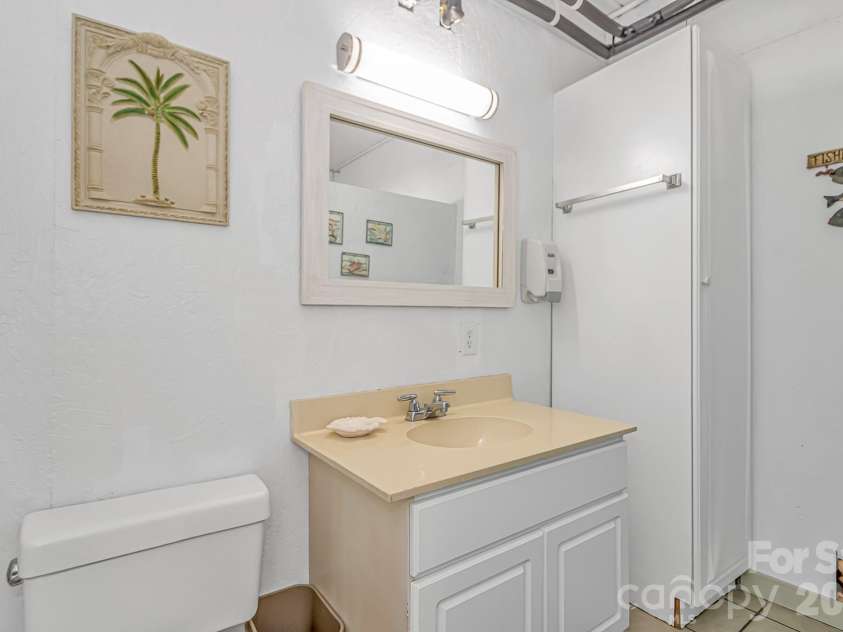 511 21st Avenue, North Myrtle Beach, SC 29582.  MLS# CAR4407127, YatesRealty ID 39556. Down staires half bathroom