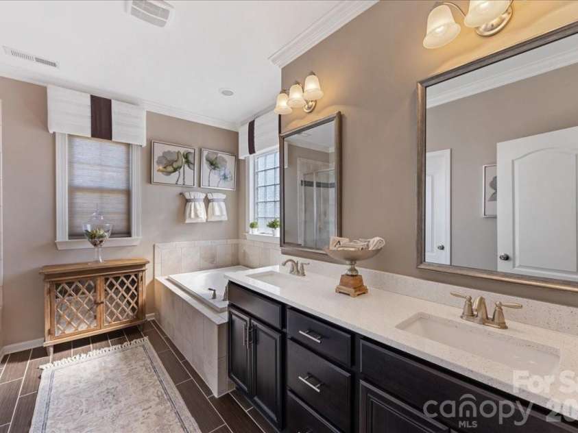 2511 Carnation Drive, Harrisburg, NC 28075.  MLS# CAR4345682, YatesRealty ID 3956. Primary bathroom