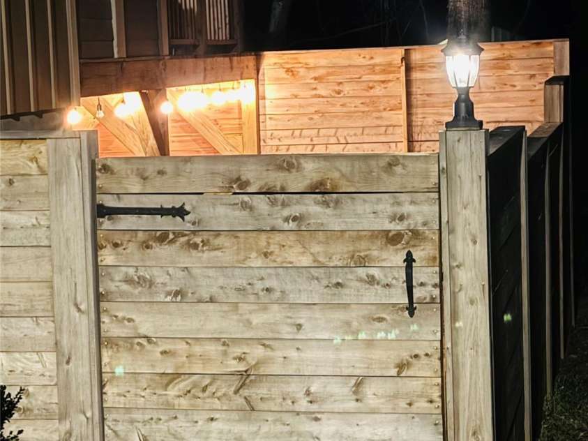 554 Sweet Birch Park Lane, Black Mountain, NC 28711.  MLS# CAR4353122, YatesRealty ID 3957. Nighttime Side Yard and Continues Below the Deck