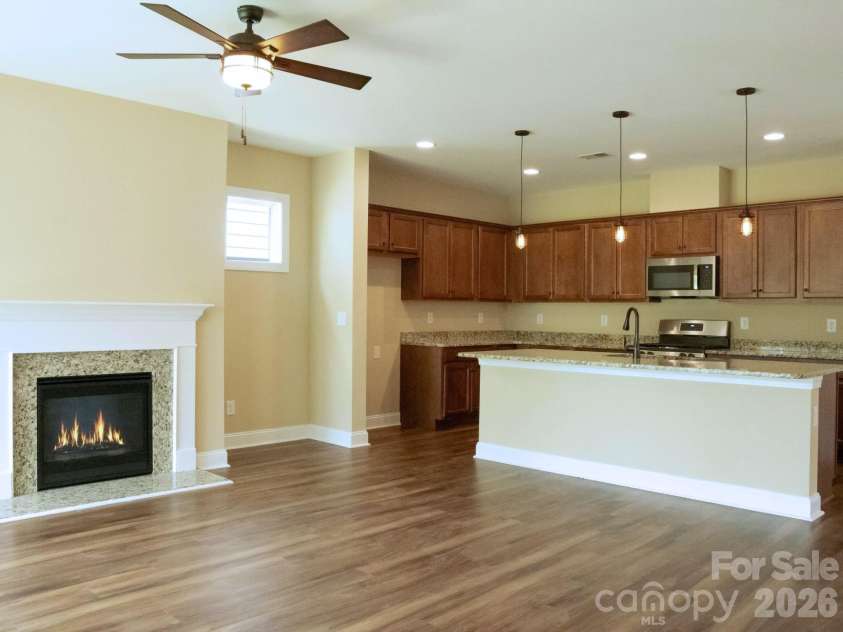 6281 Raven Rock Drive, Denver, NC 28037.  MLS# CAR4401364, YatesRealty ID 39588. Kitchen and Fireplace