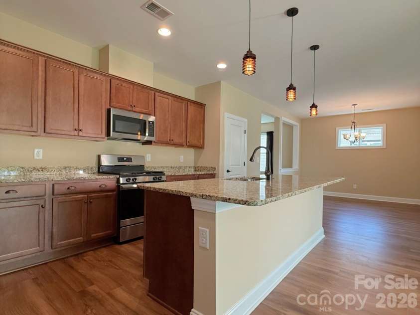 6281 Raven Rock Drive, Denver, NC 28037.  MLS# CAR4401364, YatesRealty ID 39588. Looking into dining room from kitchen