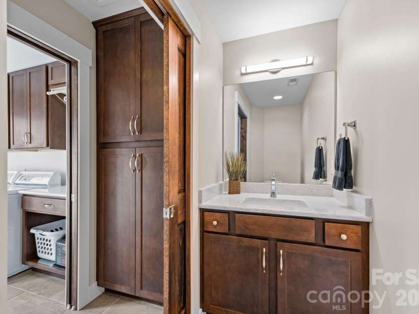 19 Dunsmore Avenue, Black Mountain, NC 28711.  MLS# CAR4337265, YatesRealty ID 3959. Inviting half bath down a short hall from the front foyer.  Across from it is the Laundry Room.