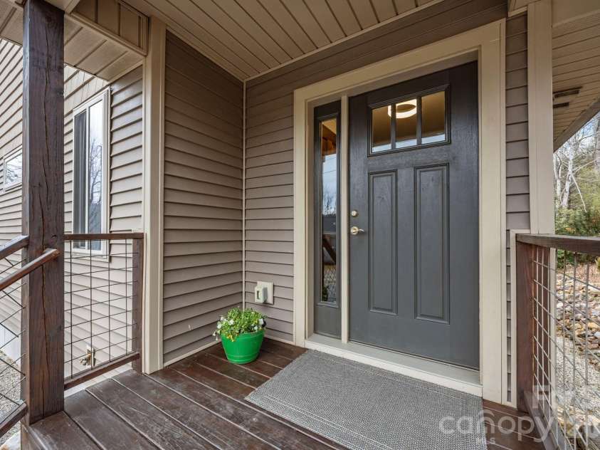 19 Dunsmore Avenue, Black Mountain, NC 28711.  MLS# CAR4337265, YatesRealty ID 3959. Nice covered front porch to keep out the hot sun and avoid the rain.