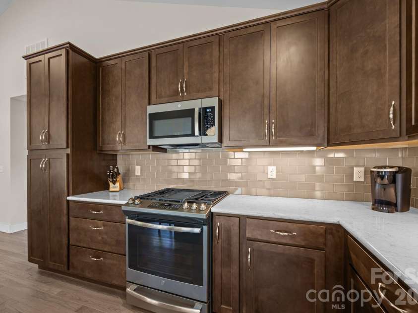 19 Dunsmore Avenue, Black Mountain, NC 28711.  MLS# CAR4337265, YatesRealty ID 3959. Stainless Appliances with a gas range.