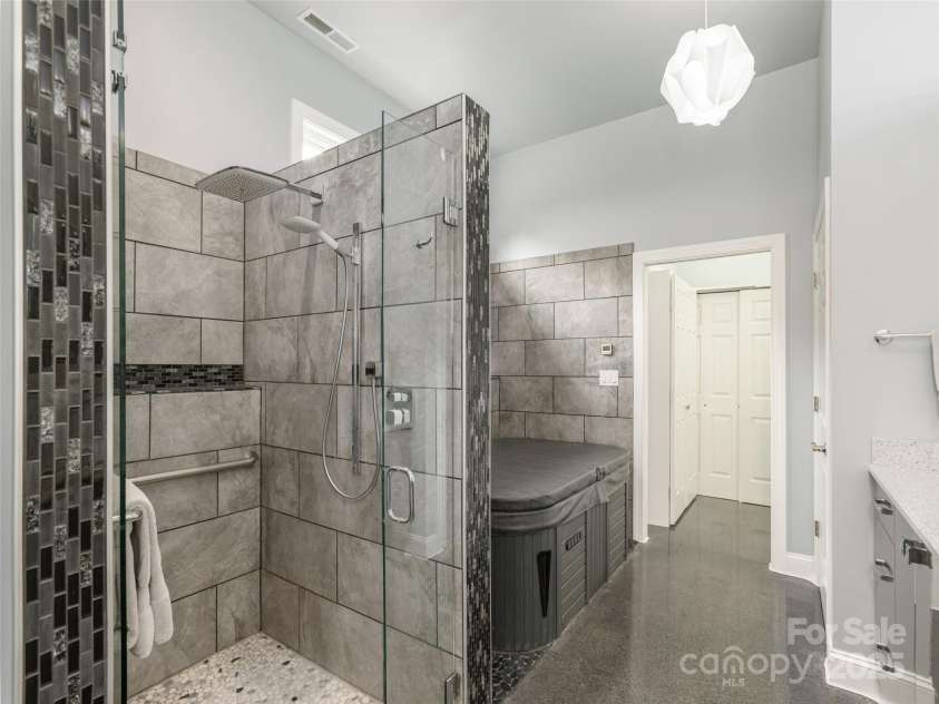 161 Birchwood Drive, Hendersonville, NC 28739.  MLS# CAR4309211, YatesRealty ID 396. Tile Spa Shower