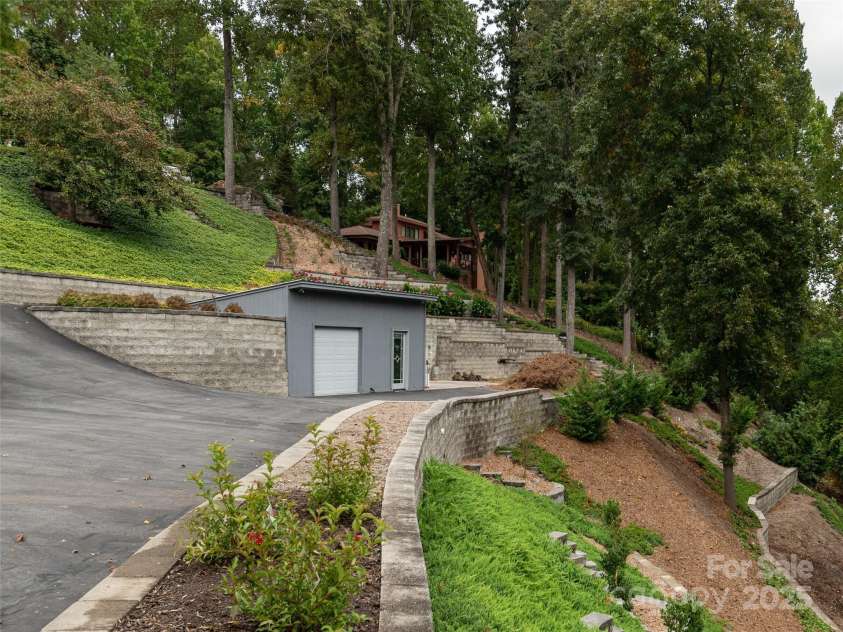 161 Birchwood Drive, Hendersonville, NC 28739.  MLS# CAR4309211, YatesRealty ID 396. Utility Building with Overhead Door