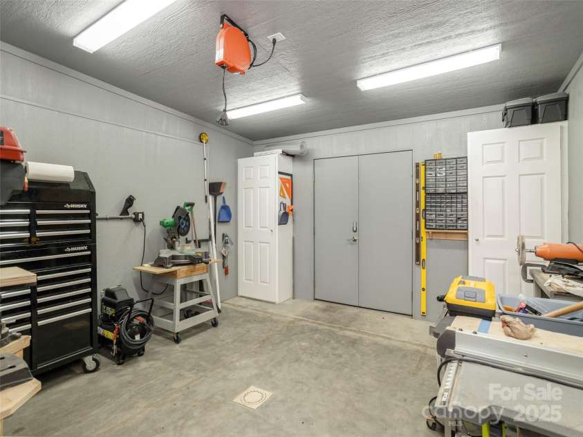 161 Birchwood Drive, Hendersonville, NC 28739.  MLS# CAR4309211, YatesRealty ID 396. Workshop that Adjoins the House