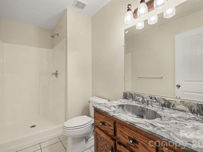121 Mossy Rock Trail, Iron Station, NC 28080.  MLS# CAR4399129, YatesRealty ID 39601. Hall bath Upper floor