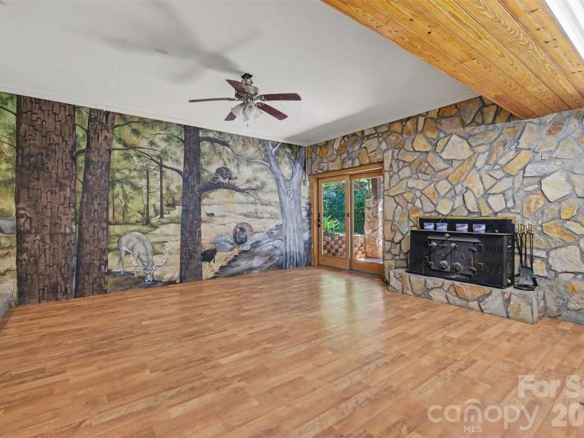 121 Mossy Rock Trail, Iron Station, NC 28080.  MLS# CAR4399129, YatesRealty ID 39601. Mural on basement wall