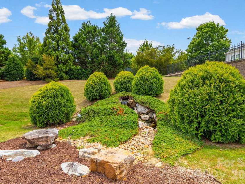 2027 Maned Goose Court, Fort Mill, SC 29707.  MLS# CAR4400613, YatesRealty ID 39604. Tranquil water feature