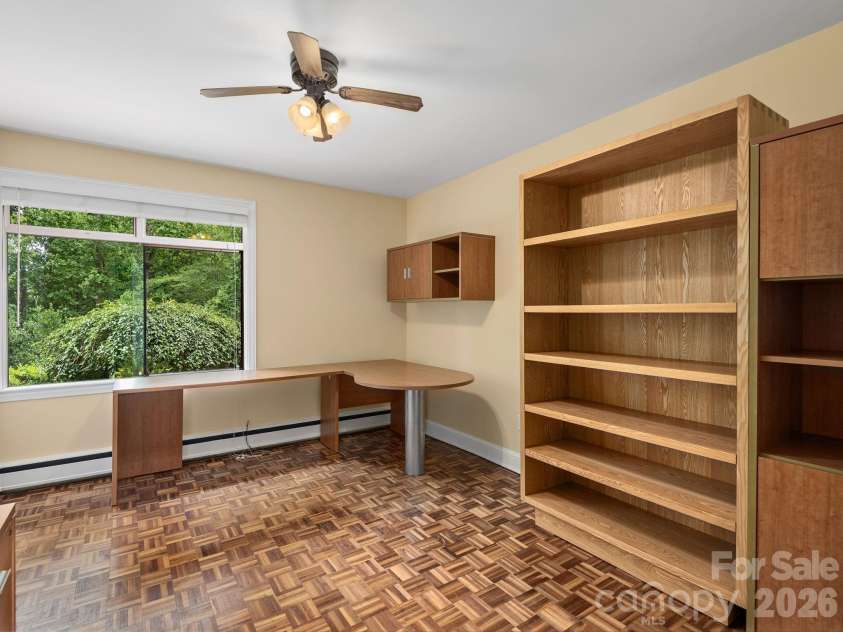 65 Cliff Drive, Laurel Park, NC 28739.  MLS# CAR4394753, YatesRealty ID 39607. A flexible lower-level room with a closet, ideal as a home office, guest room, or additional bedroom