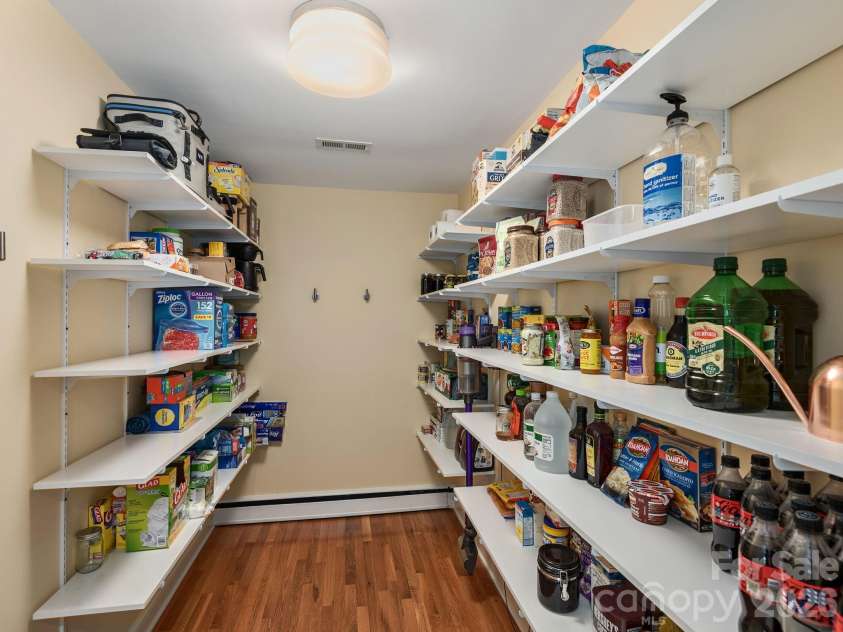 65 Cliff Drive, Laurel Park, NC 28739.  MLS# CAR4394753, YatesRealty ID 39607. A spacious walk-in pantry provides exceptional storage and organization for everyday living