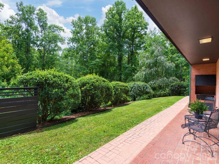 65 Cliff Drive, Laurel Park, NC 28739.  MLS# CAR4394753, YatesRealty ID 39607. Fire up the built-in grill and dine outdoors on the spacious covered patio