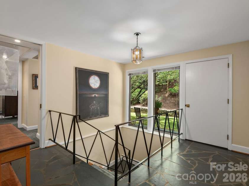 65 Cliff Drive, Laurel Park, NC 28739.  MLS# CAR4394753, YatesRealty ID 39607. Natural slate flooring and geometric railing details