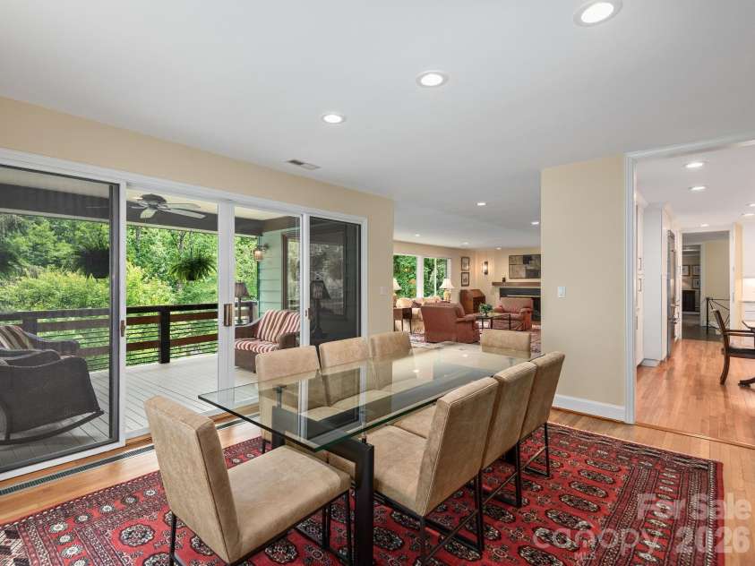 65 Cliff Drive, Laurel Park, NC 28739.  MLS# CAR4394753, YatesRealty ID 39607. The dining room is filled with natural light and flows seamlessly to both the kitchen and the covered deck