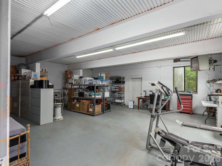 65 Cliff Drive, Laurel Park, NC 28739.  MLS# CAR4394753, YatesRealty ID 39607. Whether you’re a craftsman, artist, or DIY enthusiast, this impressive lower-level workshop is ready for your next project