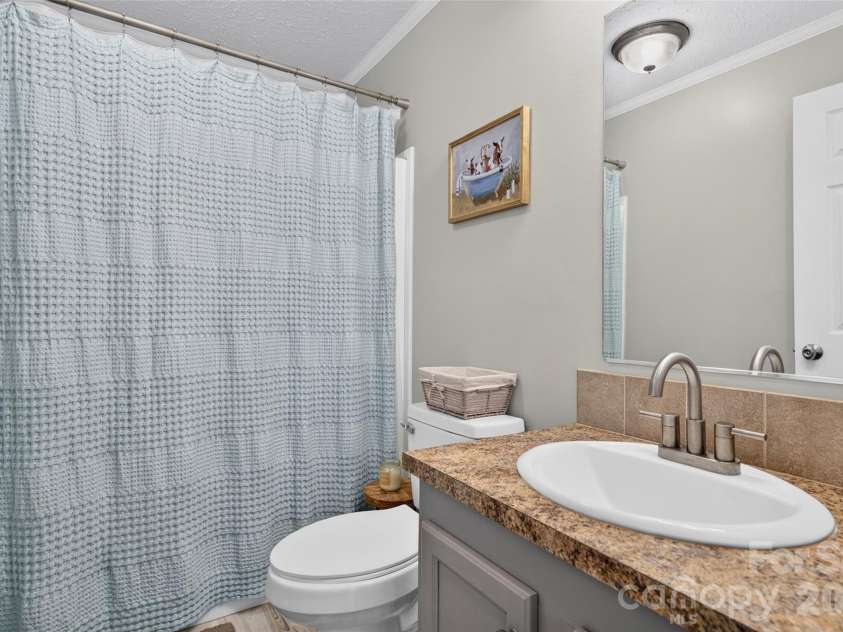 147 Ty Lin Way, Troutman, NC 28166.  MLS# CAR4407100, YatesRealty ID 39615. Hall Bathroom