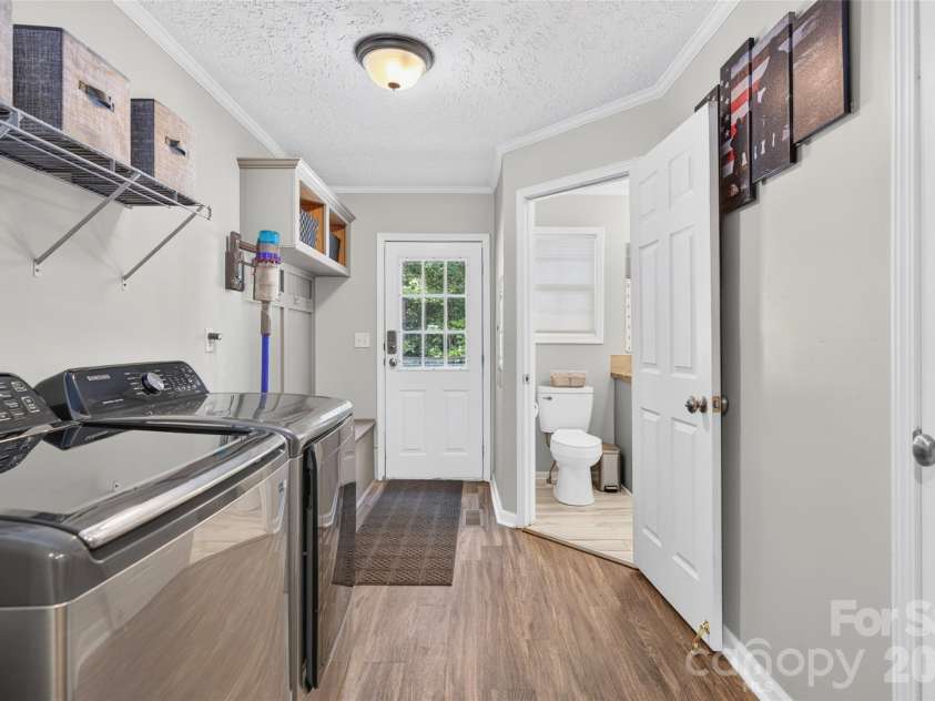 147 Ty Lin Way, Troutman, NC 28166.  MLS# CAR4407100, YatesRealty ID 39615. Laundry/Mudd Room right off the Kitchen