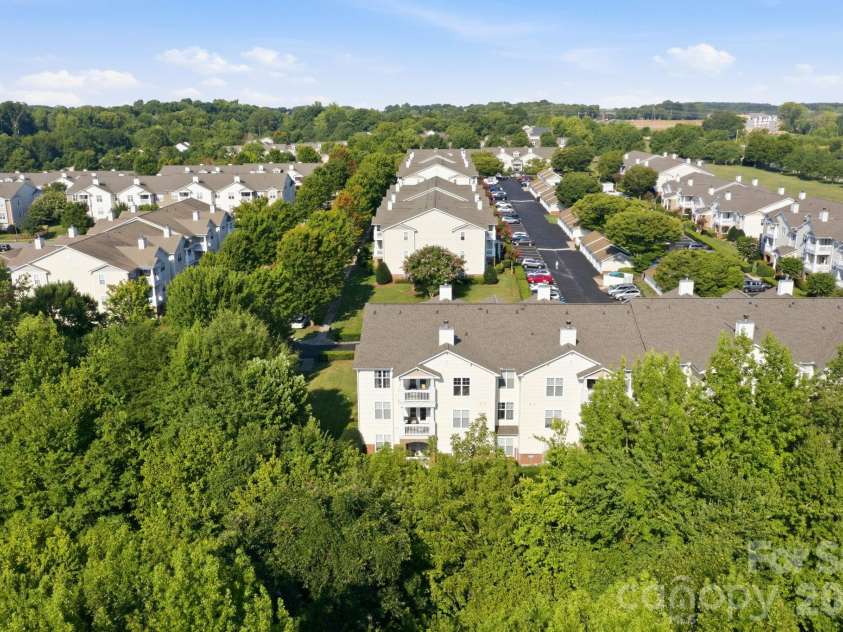 17257 Doe Valley Court, Cornelius, NC 28031.  MLS# CAR4405908, YatesRealty ID 39617. Aerial of Community w/ 3rd-Floor End-Unit Centered in Frame