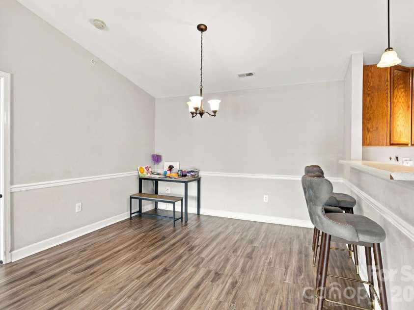 17257 Doe Valley Court, Cornelius, NC 28031.  MLS# CAR4405908, YatesRealty ID 39617. Dining Area w/ Breakfast Bar