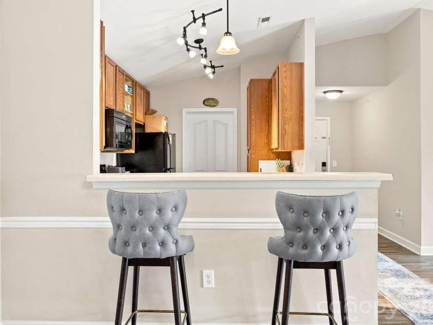 17257 Doe Valley Court, Cornelius, NC 28031.  MLS# CAR4405908, YatesRealty ID 39617. Dining Area w/ Breakfast Bar