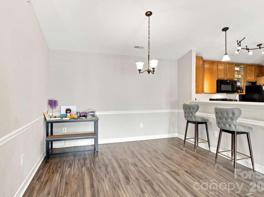 17257 Doe Valley Court, Cornelius, NC 28031.  MLS# CAR4405908, YatesRealty ID 39617. Dining Area w/ Breakfast Bar into Kitchen